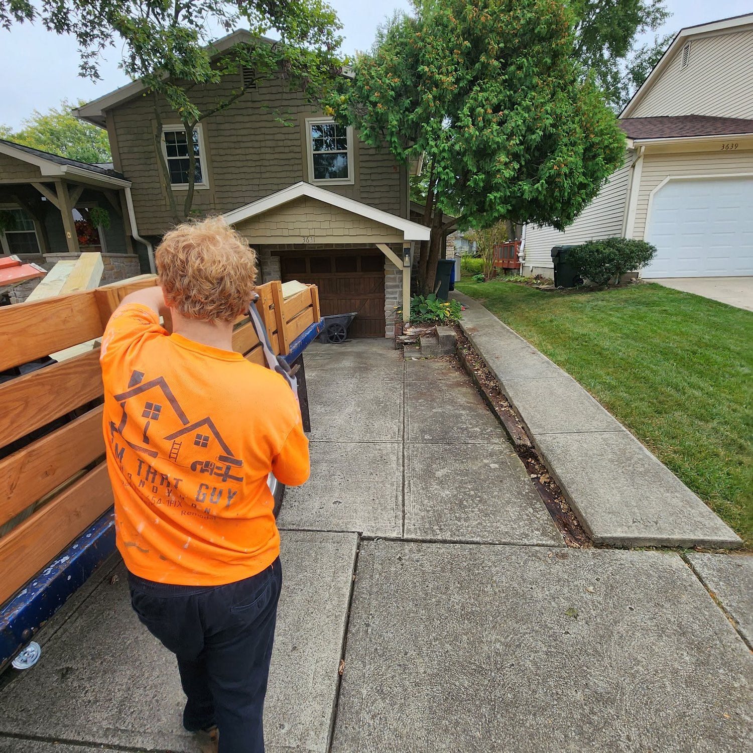 Crew member hauling materials on a job